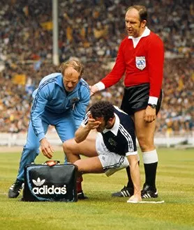 Images Dated 4th June 1977: Scotlands Danny McGrain is injured - 1977 British Home Championship