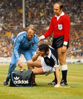Images Dated 4th June 1977: Scotlands Danny McGrain is injured - 1977 British Home Championship