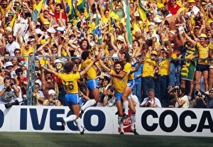Images Dated 5th December 2011: Socrates celebrates with his teammates after scoring for Brazil at the 1982 World Cup