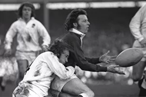 Wales JJ Williams is tackled by Englands Peter Squires - 1974 Five Nations