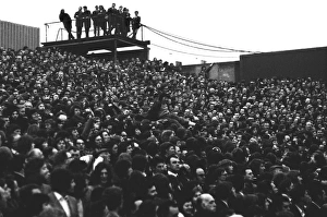 A young fan is passed over the heads of fans in the Clock End at Highbury during the 1973 A young fan is passed over the heads of fans in the Clock End at Highbury during the 1973