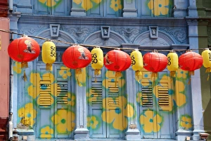 Chinese lanterns hanging in the street between buildings in Chinatown, Singapore Chinese lanterns hanging in the street between buildings in Chinatown, Singapore