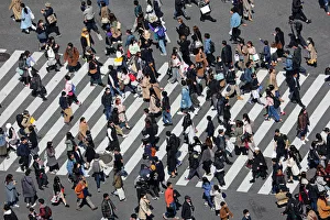 Crowds crossing the Shibuya pedestrian crossing in Shibuya, Tokyo, Japan Crowds crossing the Shibuya pedestrian crossing in Shibuya, Tokyo, Japan