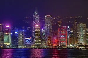 Lights of the city skyline of Central across Victoria Harbour at night in Hong Kong Lights of the city skyline of Central across Victoria Harbour at night in Hong Kong