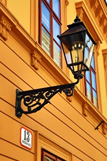 Metal street lamp on a building in Matoseva Ulica in Zagreb, Croatia Metal street lamp on a building in Matoseva Ulica in Zagreb, Croatia