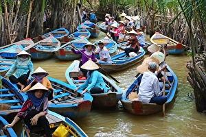 People on Sampan boats on canals on Con Lan (Unicorn) Island, near My Tho, Mekong Delta People on Sampan boats on canals on Con Lan (Unicorn) Island, near My Tho, Mekong Delta