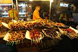 Satay stall with street food in Jalan Alor in Bukit Bintang in Kuala Lumpur, Malaysia Satay stall with street food in Jalan Alor in Bukit Bintang in Kuala Lumpur, Malaysia