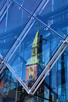 Scandic Hotel clock tower reflected in a diamond shaped glass window in Copenhagen Scandic Hotel clock tower reflected in a diamond shaped glass window in Copenhagen