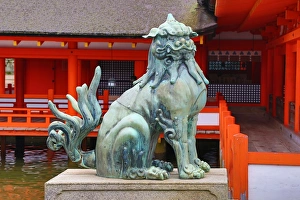 Stone lion statue at Itsukushima Shinto Shrine on Miyajima Island, Hiroshima, Japan Stone lion statue at Itsukushima Shinto Shrine on Miyajima Island, Hiroshima, Japan