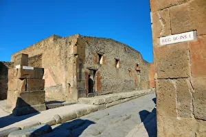 Street and ruins of houses in the ancient Roman city of Pompeii, Italy Street and ruins of houses in the ancient Roman city of Pompeii, Italy