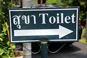 Toilet sign in Thai at Wat Phra Singh Temple in Chiang Mai, Thailand Toilet sign in Thai at Wat Phra Singh Temple in Chiang Mai, Thailand