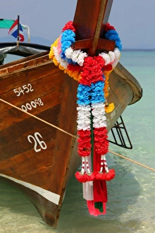Traditional Thai long tailed boats on Ko Phi Phi Don island beach in Thailand Traditional Thai long tailed boats on Ko Phi Phi Don island beach in Thailand