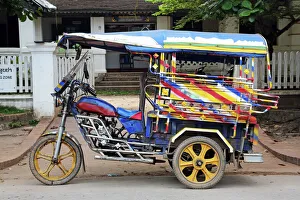 Three wheeled Tuk Tuk taxi in Luang Prabang, Laos Three wheeled Tuk Tuk taxi in Luang Prabang, Laos