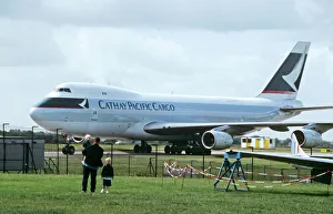 Boeing 747-200F Cathay Pacific Cargo being watched by family Boeing 747-200F Cathay Pacific Cargo being watched by family