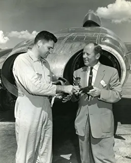 <b class=qtipBold><figcaption>Don Schultz & Karl Baur</figcaption></b><br>Schultz explains a control stick extension device he developed for use during flight testing the F7U-3 cutlass to Karl Baur, formerly chief test pilot for Messerschmitt Aircraft Co.<br><em>© Flightglobal 2012</em> Don Schultz & Karl Baur