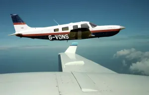 Print of Piper Saratoga over the Channel