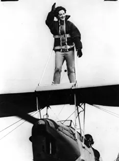 <b class=qtipBold><figcaption>Sky High for Holiday Fun</figcaption></b><br>Lollie Benjamin, 23 created quite a sensation with the onlookers when she went for a flight standing on the wing of a Tiger Moth aircraft.<br><em>© Flightglobal</em> Sky High for Holiday Fun