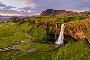 Aerial Views Gallery: Aerial drone view of Seljalandsfoss waterfall at sunset, Iceland