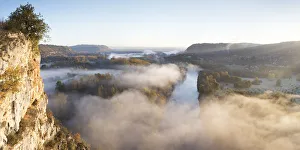 Aerial view of the Dordogne Valley & Dordogne river on a misty morning in autumn, Lot Aerial view of the Dordogne Valley & Dordogne river on a misty morning in autumn, Lot