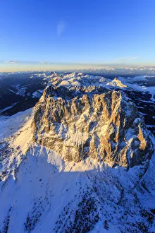 Aerial view of Sassolungo Sassopiatto and Grohmann peak at sunset Aerial view of Sassolungo Sassopiatto and Grohmann peak at sunset
