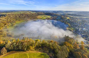 Aerial view on the Schalkenmehren maar lake with morning fog, Schalkenmehren near Daun Aerial view on the Schalkenmehren maar lake with morning fog, Schalkenmehren near Daun