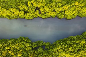 Aerial view of a traditional boat sailing through the bay Aerial view of a traditional boat sailing through the bay
