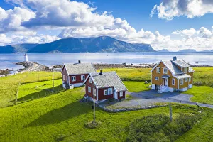 Aerial view of traditional houses and Hogsteinen Lighthouse, Godoya Island, Alesund Aerial view of traditional houses and Hogsteinen Lighthouse, Godoya Island, Alesund