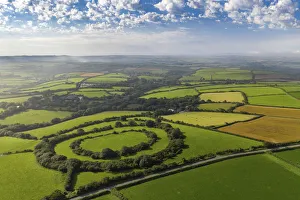 Aerial vista of Tregeare Rounds Iron Age Hillfort surrounded by Cornish countryside Aerial vista of Tregeare Rounds Iron Age Hillfort surrounded by Cornish countryside
