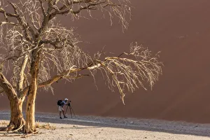 Africa, Namibia, Sossusvlei. Photographer at Dune 45 Africa, Namibia, Sossusvlei. Photographer at Dune 45