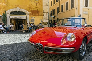 Alfa Romeo Duetto spider parked in a cobblestone street of Rome, Lazio, Italy Alfa Romeo Duetto spider parked in a cobblestone street of Rome, Lazio, Italy