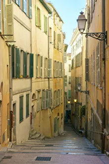 Alleyway with stairs between colorful buildings, Vieille Ville (Old Town), Nice Alleyway with stairs between colorful buildings, Vieille Ville (Old Town), Nice