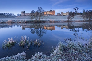Alnwick Castle reflected in the River Aln on a frosty winter morning, Northumberland, England Alnwick Castle reflected in the River Aln on a frosty winter morning, Northumberland, England