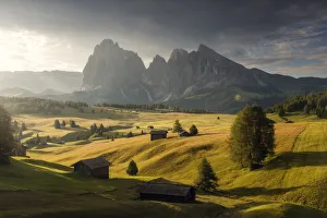 Alpine meadow and wooden huts in the Dolomites, Italy Alpine meadow and wooden huts in the Dolomites, Italy