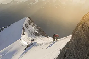 Alpinists along normal route to Nadelhorn, a 4000 peak in Sass Fe valley Alpinists along normal route to Nadelhorn, a 4000 peak in Sass Fe valley