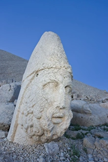 Ancient carved stone head of Zeus Ancient carved stone head of Zeus