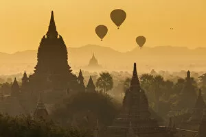 Images Dated 2nd July 2013: Ancient temple city of Bagan (Pagan) & balloons at sunrise, Myanmar (Burma)