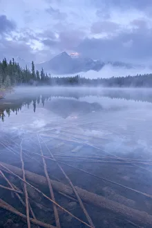 Atmospheric misty morning in the Canadian Rockies, Herbert Lake, Banff National Park Atmospheric misty morning in the Canadian Rockies, Herbert Lake, Banff National Park
