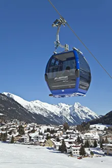 Austria, Tirol. St. Anton am Arlberg, Gondola over the lower resort slopes Austria, Tirol. St. Anton am Arlberg, Gondola over the lower resort slopes