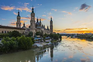 Basilica de Nuestra Senora del Pilar church and Ebro river at sunset, Zaragoza, Aragon Basilica de Nuestra Senora del Pilar church and Ebro river at sunset, Zaragoza, Aragon