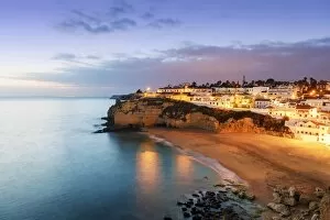 Illumination Collection: The beach of Carvoeiro at dusk. Algarve, Portugal
