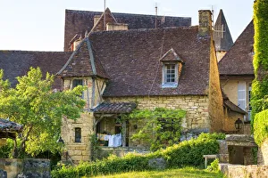 Beautiful old stone house on Rue Montaigne in late afternoon sun Beautiful old stone house on Rue Montaigne in late afternoon sun