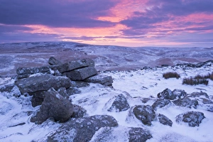 Beautiful sunrise over a frozen and snow covered Belstone Tor, Dartmoor National Park Beautiful sunrise over a frozen and snow covered Belstone Tor, Dartmoor National Park