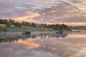 Beautiful sunrise above a tranquil Wimbleball Reservoir in Exmoor National Park, Somerset, England Beautiful sunrise above a tranquil Wimbleball Reservoir in Exmoor National Park, Somerset, England