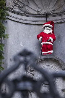 Belgium, Brussels, Manneken Pis, fountain statue and a symbol of Brussels, wearing Belgium, Brussels, Manneken Pis, fountain statue and a symbol of Brussels, wearing