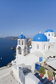 Blue domed churches in the village of Oia (La), Santorini (Thira), Cyclades Islands Blue domed churches in the village of Oia (La), Santorini (Thira), Cyclades Islands