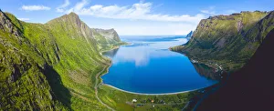 Blue sea of fjord framed by Husfjellet mountain in summer, aerial view, Steinfjord, Senja Blue sea of fjord framed by Husfjellet mountain in summer, aerial view, Steinfjord, Senja