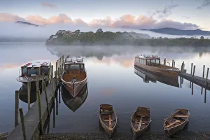 Boats on Derwent Water on a misty autumn morning, Lake District National Park, Keswick Boats on Derwent Water on a misty autumn morning, Lake District National Park, Keswick