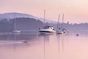 Lake Windermere Gallery: Boats moored on Lake Windermere at sunset, Bowness, Lake District, Cumbria, England