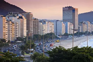 Brazil, Rio De Janeiro, Copacabana, Traffic along Avenue Atlantica at dawn Brazil, Rio De Janeiro, Copacabana, Traffic along Avenue Atlantica at dawn