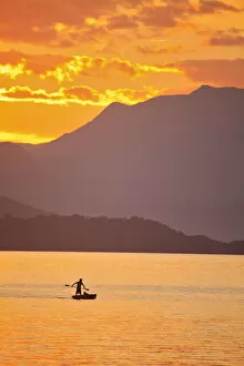 Images Dated 4th December 2012: Brazil, Rio de Janeiro State, Angra dos Reis, Ilha Grande, a fisherman silhouetted
